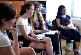 Volunteer Language Courses Romanian language course students listen intently during a lesson in Romania