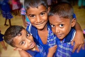 Volunteer Sri Lanka Children smile for the camera at a Care and Community placement in Sri Lanka