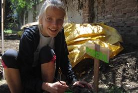 Volunteer Argentina An Agriculture & Farming volunteer fertilises an organic vegetable garden at a reserve in Argentina.