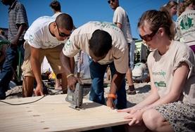 Volunteer Building Building volunteers work together to construct a community centre in a local township in South Africa.