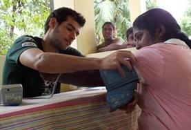 Volunteer Sri Lanka A Medicine volunteer in Sri Lanka measures a woman's blood pressure as part of a screening outreach over the Christmas holidays.