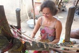 Volunteer Creative & Performing Arts An Arts & Crafts volunteer learns how to weave using a traditional loom at her placement in Togo.