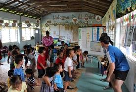 Volunteer Samoa A group of volunteers spends time with children in a local village in Samoa during their cultural immersion project.
