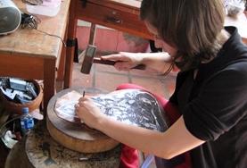 Volunteer Culture & Community A Volunteer does craft work while on a Khmer Project in Cambodia