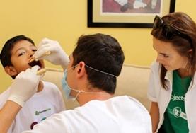 Volunteer Mexico A Dentistry Elective intern watches as a local dentist examines a young boy's teeth at a hospital in Mexico.