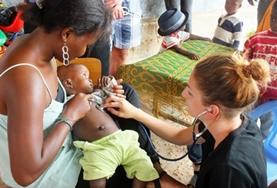 Volunteer Medical Electives Two Medicine Elective interns assist a local doctor in Togo with administering HIV tests during a medical outreach.