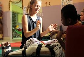 Volunteer Morocco A Physiotherapy intern listens as local medical staff explain a patient's condition at her elective placement in Morocco.