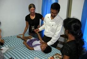 Volunteer Medical Electives An intern doing her Physiotherapy Elective in Sri Lanka observes as a local physiotherapist demonstrates a treatment technique.