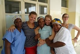 Volunteer Midwifery An intern doing her Midwifery Elective in a developing country holds a newborn baby.