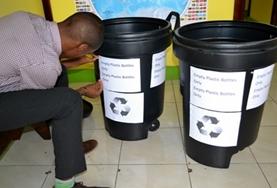 Volunteer International Development A volunteer labels bins at a placement
