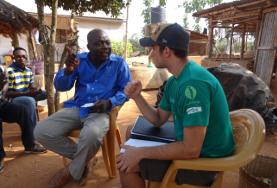 Volunteer International Development An International Development volunteer discusses sustainable business plans with the staff member of a local NGO in Togo.