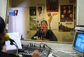 Volunteer Journalism A Journalism volunteer participates on a radio braodcast
