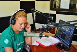Volunteer Philippines A Journalism intern makes a recording for a local radio station during her internship in the Philippines.