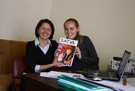 Volunteer Romania A local journalist and a Journalism intern in Romania hold the magazine that they have been working on together.