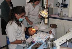 Volunteer Medicine & Healthcare A dentistry volunteer works with a patient at a placement in Cochabamnba