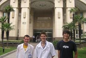 Volunteer China Dentistry interns stand outside their internship placement hospital in China.