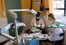 Volunteer Kenya A professional dentist demonstrates a procedure to Dentistry volunteers doing their internship in Kenya.