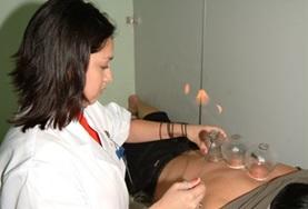 Volunteer China A Medicine intern observes as a local doctor performs a traditional Chinese medicine technique known as cupping.