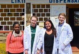 Volunteer Ghana Medicine interns weigh a baby at our volunteer placement hospital in Ghana.
