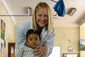 Volunteer Nepal A Medicine volunteer in Nepal measures a child's blood pressure as part of a medical screening outreach.