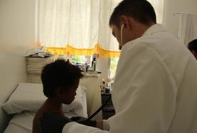 Volunteer Philippines Medical volunteers examine a patient's file at our Medicine internship in the Philippines.