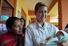 Volunteer Peru A Midwifery intern holds a newborn baby at her volunteer placement in Peru.