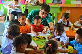 Volunteer Philippines Under the guidance of a qualified occupational therapist, a medicine volunteer in the Philippines administers a test to determine the tasks that a disabled child is struggling with.