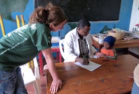 Volunteer Tanzania A local occupational therapist demonstrates an assessment technique to a Medical intern in Tanzania.