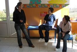 Volunteer Romania Physiotherapy interns volunteering in Romania listen as a local physiotherapist teaches them about therapy techniques.
