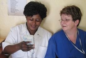 Volunteer Tanzania A Physiotherapy volunteer speaks to a local medical staff member about treatment techniques in Tanzania.
