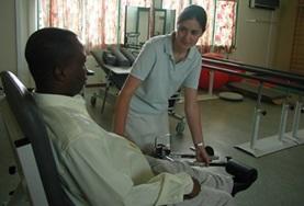 Volunteer Togo A Physiotherapy intern assesses a child with mobility difficulties at our volunteer placement in Togo.