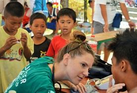 Volunteer Philippines A Public Health intern assesses a child's health during a volunteer medical outreach in the Philippines.