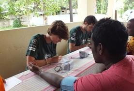 Volunteer Sri Lanka A Public Health volunteer in Sri Lanka measures a local man's blood pressure, gaining important medical experience during her internship.