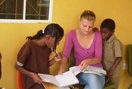 Volunteer Care A Social Work volunteer has a discussion with local children
