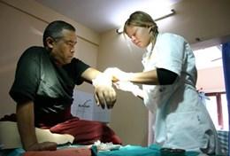Volunteer Medicine & Healthcare An acupuncury volunteer works with a patient on a placement in Nepal