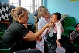 Volunteer Medicine & Healthcare A volunteer doctor examines a patient on a placement in Nepal