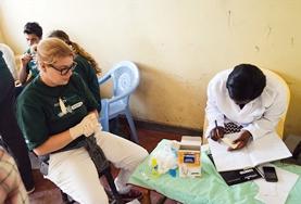 Volunteer Medicine & Healthcare A volunteer and local nurse make notes