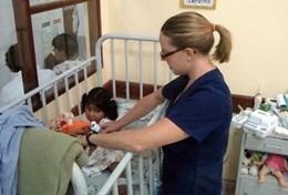 Volunteer Medicine & Healthcare An Occupational Therapist volunteer works with a child her placement at a care centre in Cochabamba