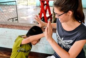 Volunteer Medicine & Healthcare An Occupational Therapy volunteer in Nepal works with a patient