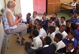 Volunteer South Africa A professional Teacher works with a class of school students at her volunteer placement in South Africa.