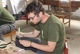 Volunteer Peru A High School Special Archaeology intern catalogues the artifacts found during a dig in Peru.