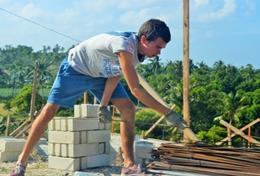 Volunteer Philippines A High School Special volunteer helps with building the framework for a house in the Philippines.