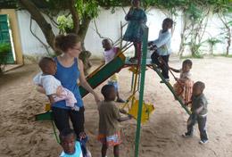 Volunteer Togo A volunteer spends time working with children in a playground at her Care & Community placement in Togo.