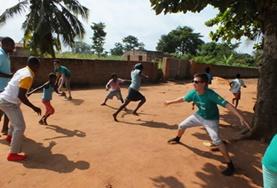 Volunteer Togo High School Special volunteers play a game with local children in Togo to help with their physical development and teamwork.