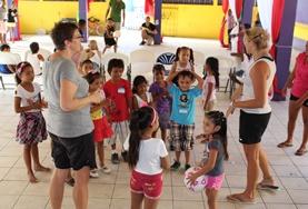 Volunteer Sports Volunteers address a group of children on a School Sports Project in Belize