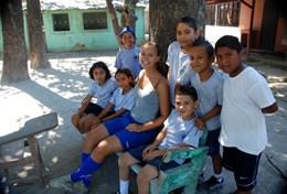 Volunteer Costa Rica A group of school children relaxes after their sports lesson as part of our volunteer School Sports project in Costa Rica.
