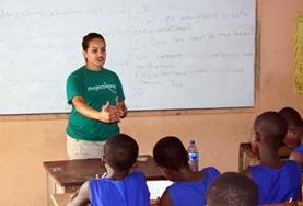 Volunteer Madagascar A Teaching volunteer explains concepts to a classroom of students at a school in Madagascar.