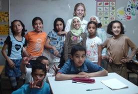 Volunteer Morocco A Teaching volunteer spends time with the students in her class at a local school in Morocco.