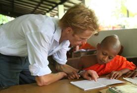 Volunteer Sri Lanka A volunteer guides a young boy through his English homework at one of our Teaching placements in Sri Lanka.