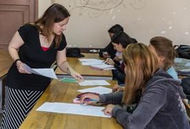 Volunteer Teaching A French teaching volunteer interacts with students in a classroom in Cochabamba
